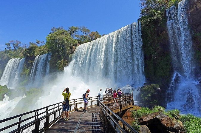 A circuit walkway threading between the falls on the Argentine side