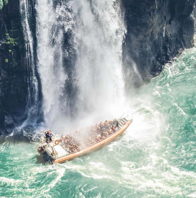 A boat in the spray at the foot of the falls