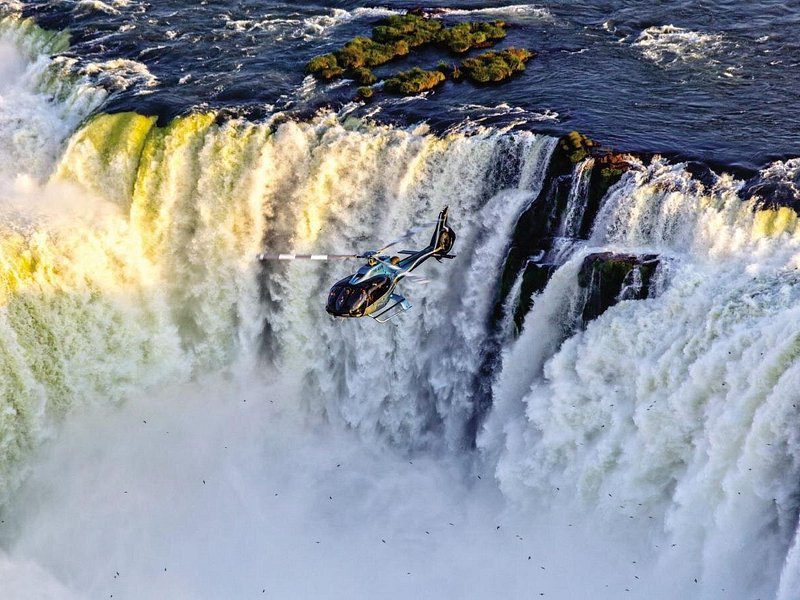 A helicopter over the falls on the Brazilian side