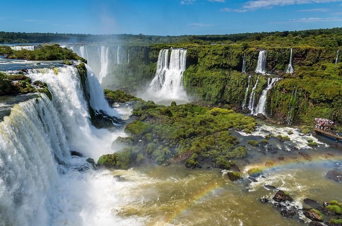 The full rim of Iguazu Falls seen across the gorge from the Brazilian side