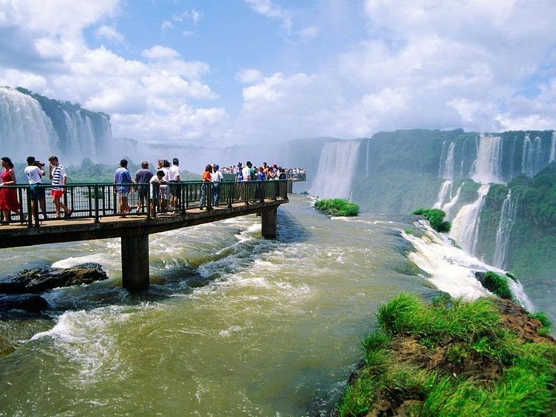 Visitors on a viewing walkway above the river